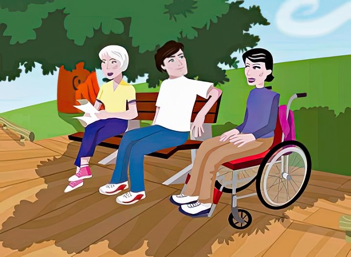 Dos personas en un banco en un sendero accesible, acompañados de una tercera persona con movilidad reducida.
